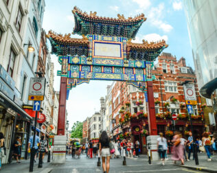 Crowds of people in London's China Town area of Soho in the west end.